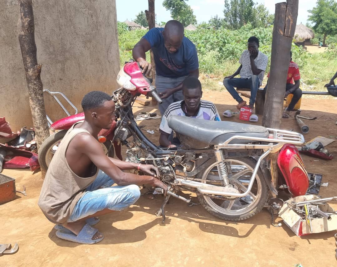 From classroom to workshop 🔧✨ OSY trainees at Omugo are hands-on with motorcycle engines, learning skills that drive opportunities forward.