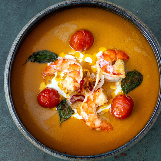 When life gives you shrimp… make it take a swim in coconut broth. Think juicy tiger shrimp, charred tomatoes, crispy basil &amp; a broth so good you’ll want to sip it straight from the bowl. 🌿🍤 Who’s ready to dive in? 🌊 bit.ly/4m82n0Q #RecipeOfTheDay