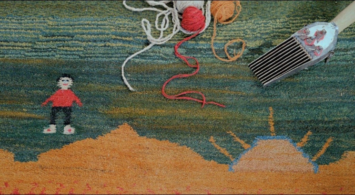 Gabbeh (1996), A film by Iranian director Mohsen Makhmalbaf. 

A parable film where art is intricately intertwined with reality, a lyrical poem about Persian carpets - gabbehs. A girl from a nomadic tribe weaves a carpet, the patterns of which embody the story of her love, the