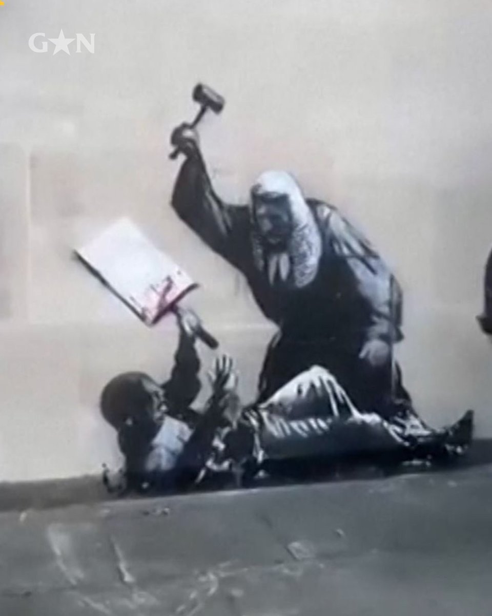 A shadow remains.. A painting by Banksy of a judge using a gavel to beat a protester on the walls of the Royal Courts of Justice in London has been removed.