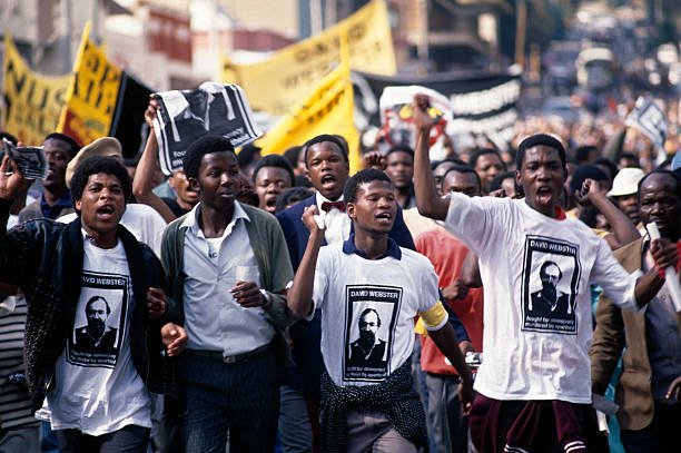 Demonstration during the funeral of anthropologist David Webster who was active in the Anti-Apartheid movement. He was shot dead by the South African Civil Cooperation Bureau (CCB), operating under the authority of the Ministry of Defense, 1989. Picture: Kevin Carter