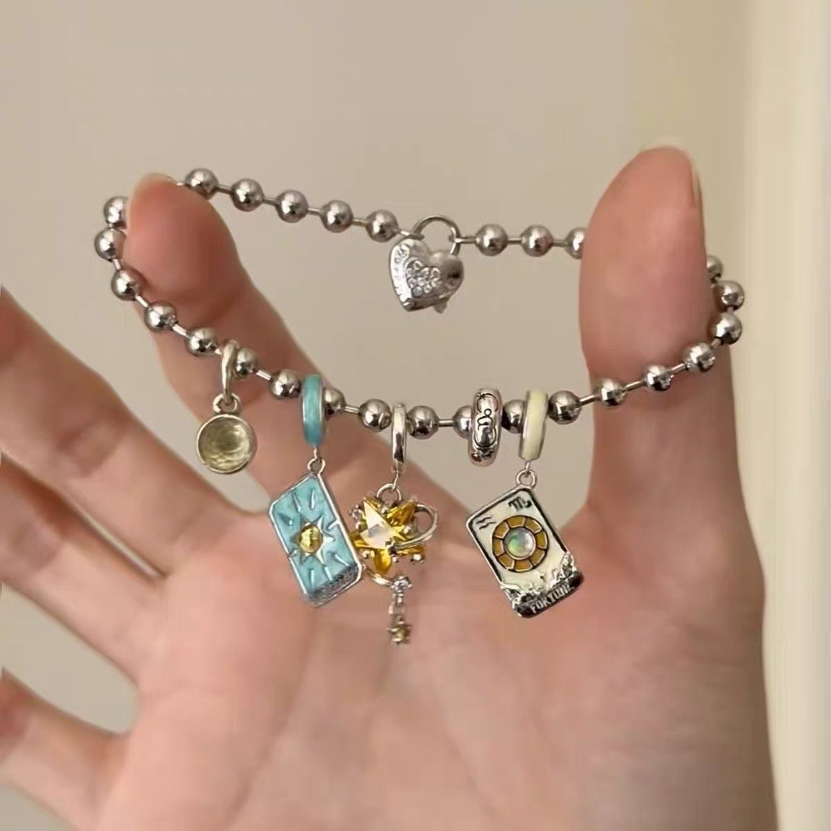 heart_jpg's tweet photo. Tarot charm bracelet https://t.co/8b2PFvBLA5