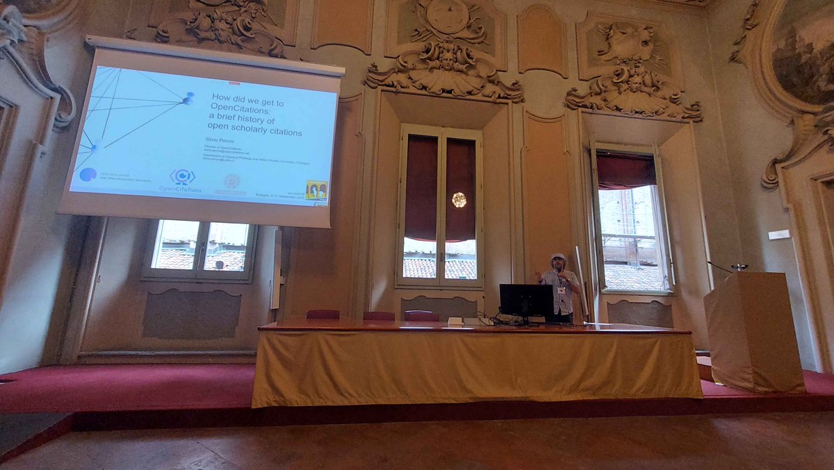 Now on stage at #csvconf: <a href="/essepuntato/">Silvio Peroni</a> presenting "How did we get to OpenCitations: a brief history of open scholarly citations" #opencitations