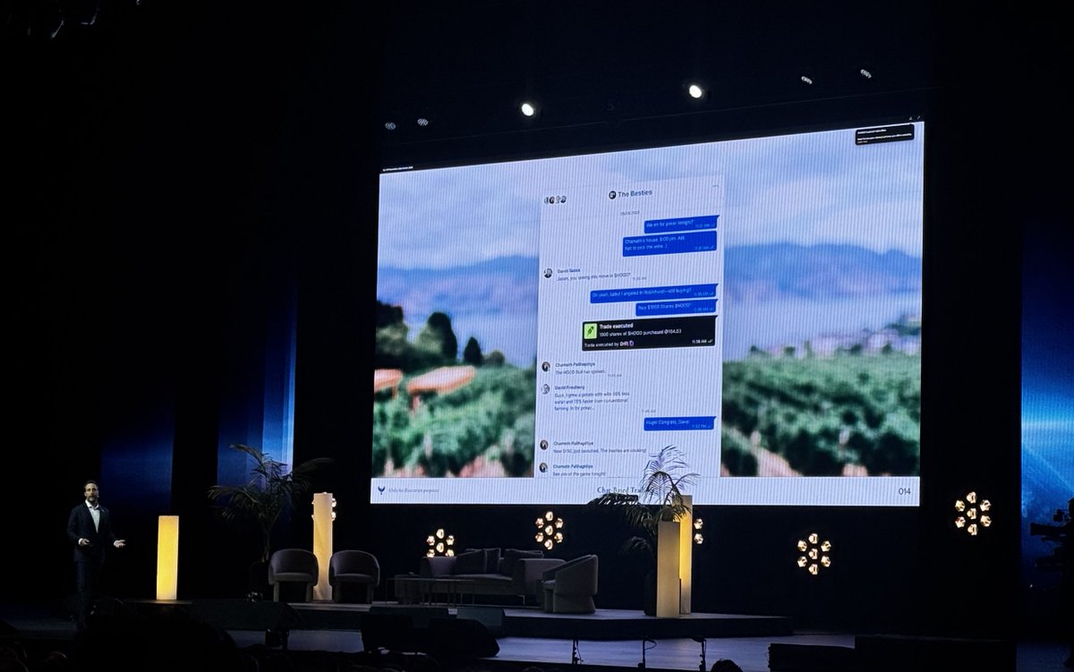 Photo from All-In Podcast summit showing Secure Chat + Global Money slide