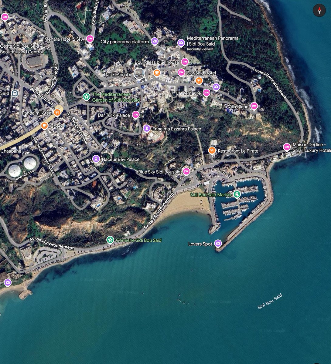 RadwenT's tweet photo. @DTealy1 @_RadicalRealist @TadhgHickey @rtenews The lighthouse is located more or less near the spot which reads Mediterranean Panorama (top right). It is the high point on Sidi Bou Saïd hill. Fun fact, the US Ambassador’s residence is the house with a pool (and tennis court) just above the spot tagged “Corniche Sidi Bou Saïd” https://t.co/C03W3fy473