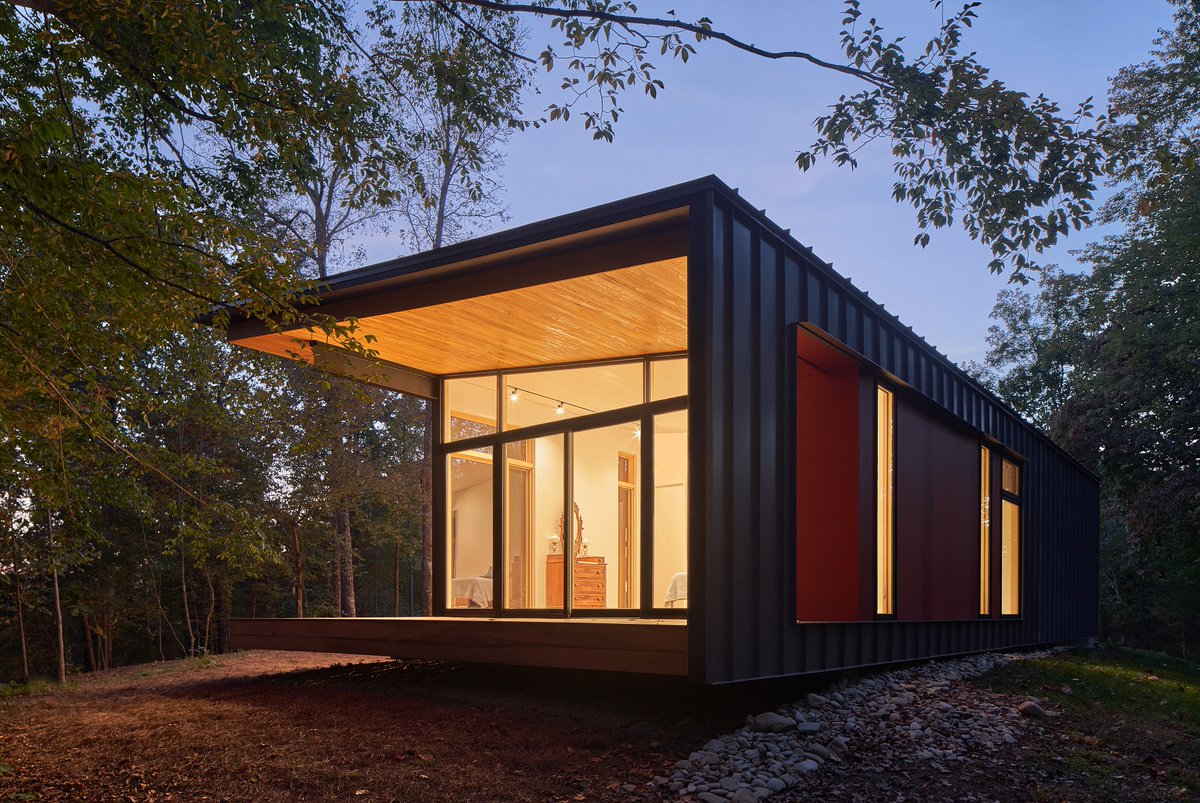 This modern cabin twists along the ridge in the foothills of the French Broad River, thoughtfully designed around the principles of simple living.  #ModernCabin