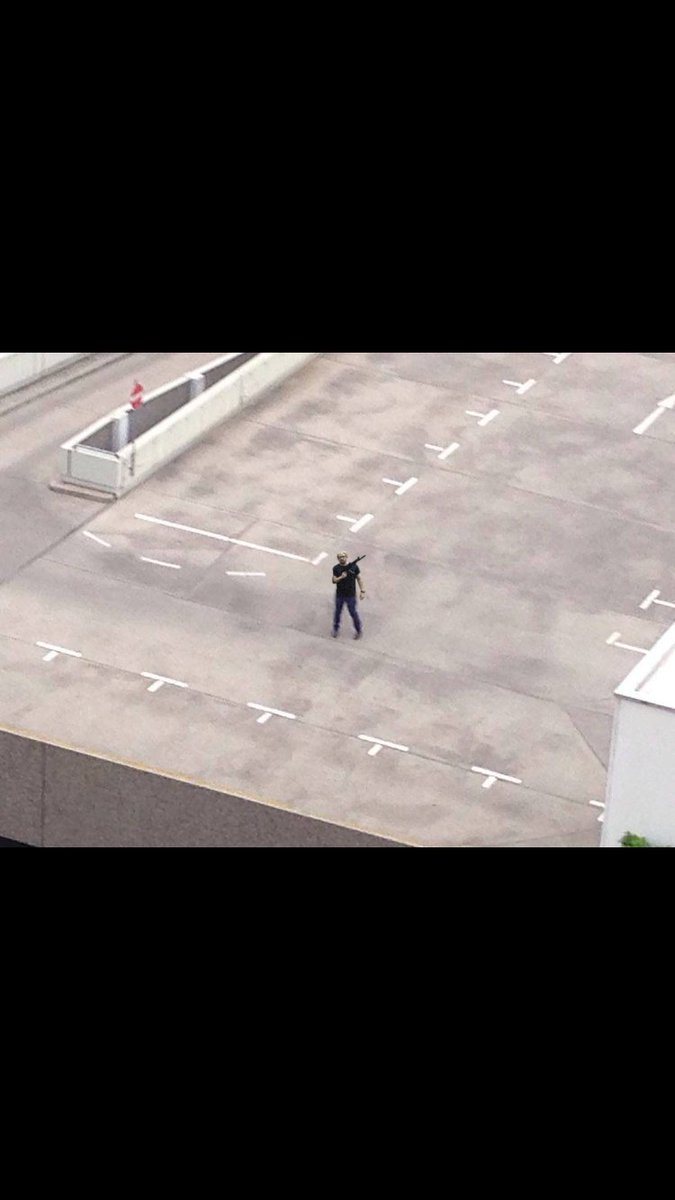 Aerial photo of the Charlie Kirk shooter on the roof at the moment of assassination.