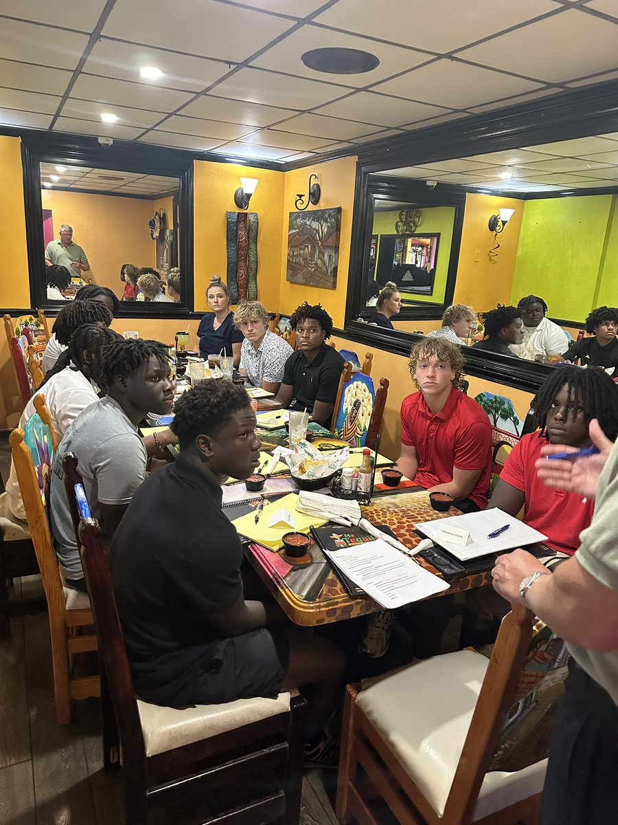 CoachHammer70's tweet image. Lely Trojans taking part in a financial literacy class and eating good on the bye week! #FOE #BiggerThanBall