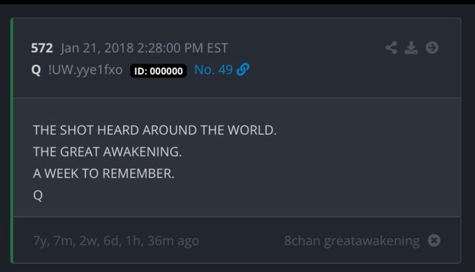 A dark-themed digital post with white text on a black background. The text reads "572 Jan 21, 2018 2:28:00 PM EST Q UUY1ef1xo ID:000000 No. 49 THE SHOT HEARD AROUND THE WORLD. THE GREAT AWAKENING. A WEEK TO REMEMBER. Q" with timestamps and board information "8chan greatawakening" visible below.
