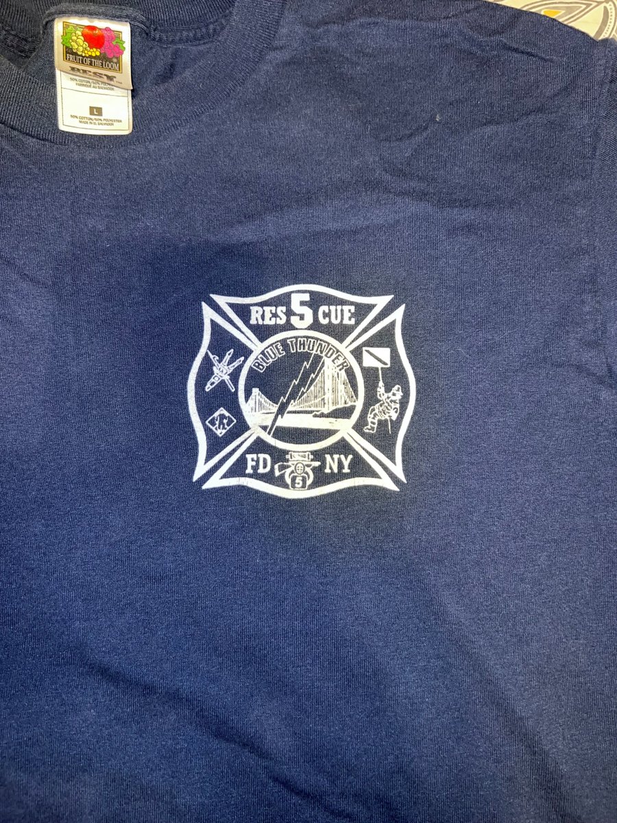 BaltCoFire's tweet photo. A Super Bowl XXXV bet. A Ravens win. FDNY Rescue 5 sent their shirt to #BCoFD Towson Fire Station. Months later, 9/11 took most of those firefighters. This shirt now symbolizes unity, courage &amp; sacrifice. #NeverForget #FDNY https://t.co/GXPK7HQk1T
