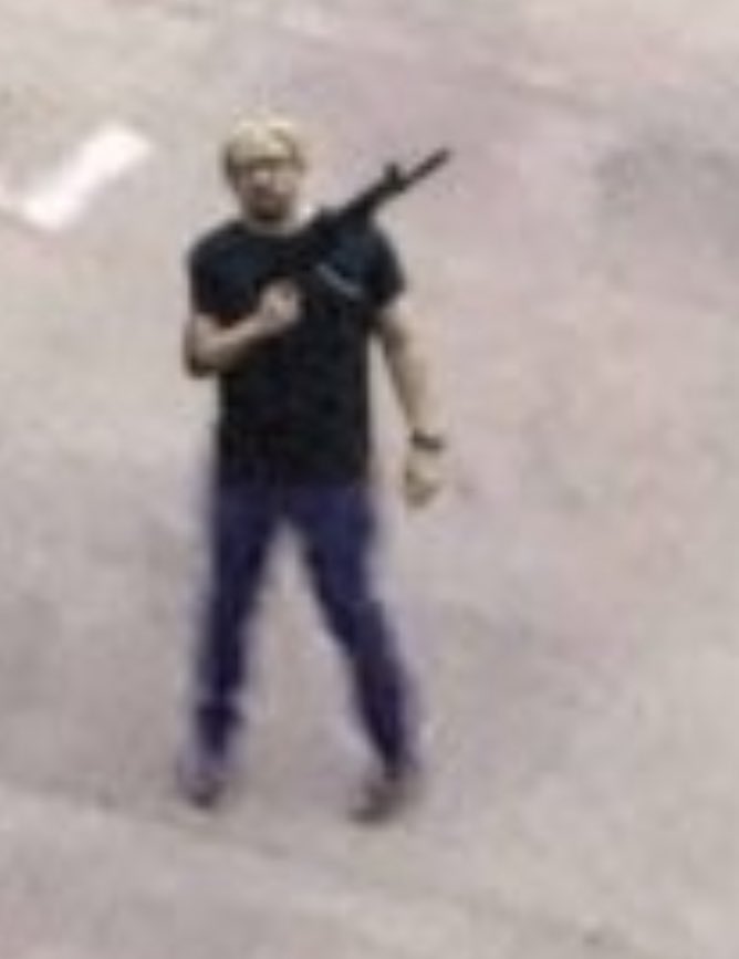 Closeup of Aerial photo of the Charlie Kirk shooter on the roof.