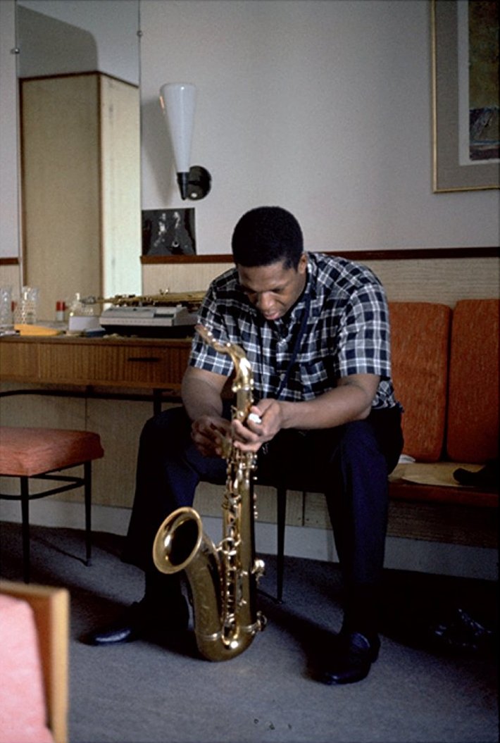 John Coltrane records on a reel to reel tape machine in his hotel room, photographed by Jean-Pierre Leloir.
Antibes, France, July 26, 1965.