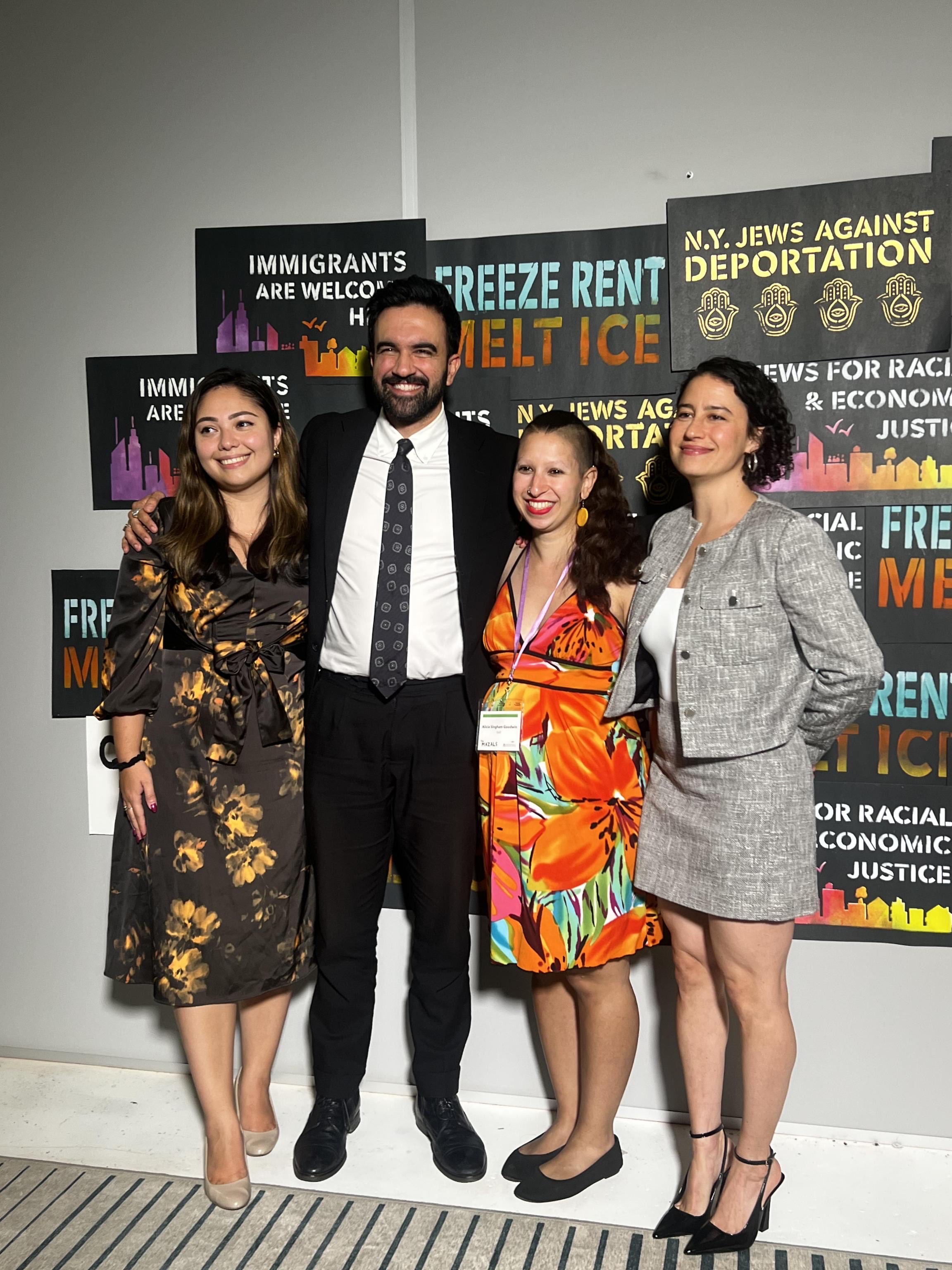 NY State Senator Kristen Gonzalez, Assemblyman Zohran Mamdani, JFREJ Political Director Alicia Singham-Goodwin and Ilana Glazer standing in front of JFREJ signage