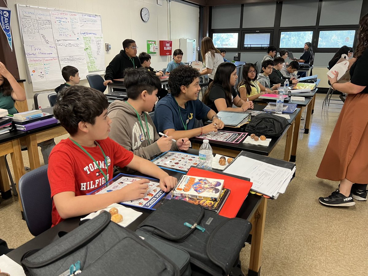 146reads1's tweet photo. Happy #Avidday from @GompersD86 These 6graders are celebrating their first year in @AVID4College by completing their #myavidwhy sheets & playing college bingo to win Avid swag! Oh, and how could I forget the donuts! https://t.co/DpCDVo4yLw