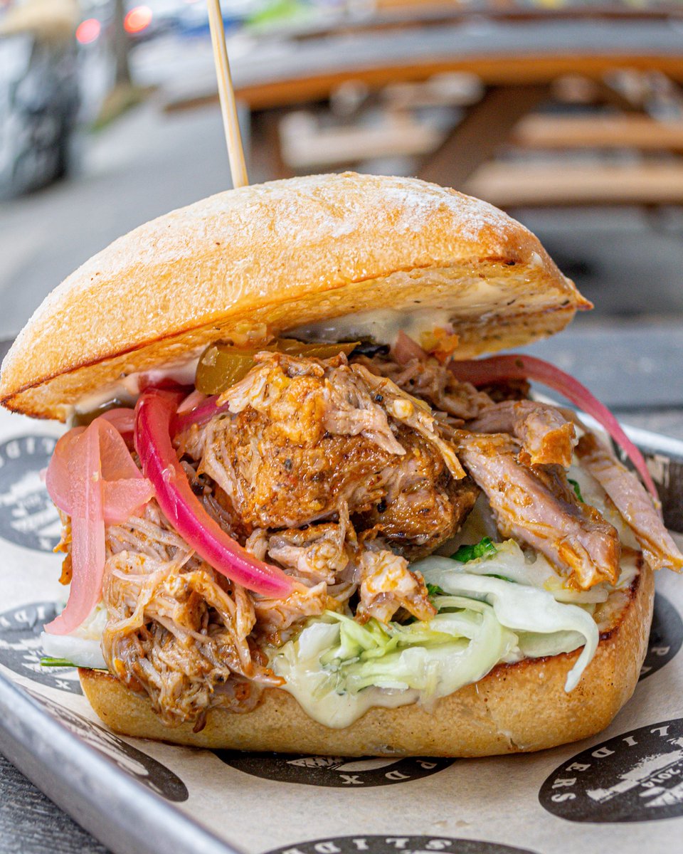 🔥NEW Special Drop!🔥

Meat the new flavor! Slow-braised Cochinitas pork with zesty citrus slaw, tangy pickled onions, and a kick of pickled jalapeños. We finish it off with your choice of habanero hot sauce (mild or spicy), a layer of aioli, all tucked into a ciabatta bun!