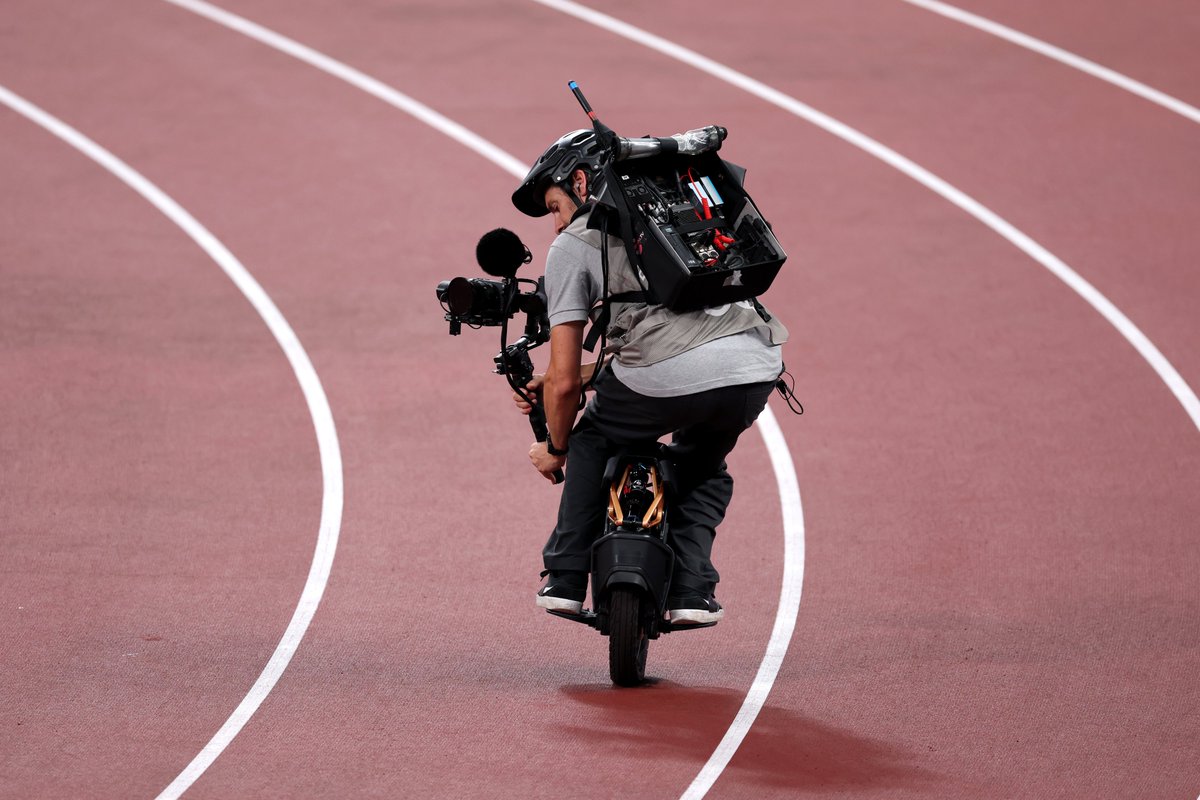 "How does the camera keep up with the athletes?" 
This guy: