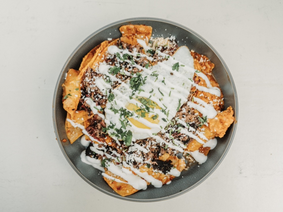 Who said you can't have brisket for brunch? Our Brisket Chilaquiles feature lightly fried tortillas simmered in rich red salsa, topped with brisket, an over-easy egg, crema, queso fresco, red onion, and cilantro!🤩

Served at our @dallasfarmersmarket location from 10AM-2PM! And