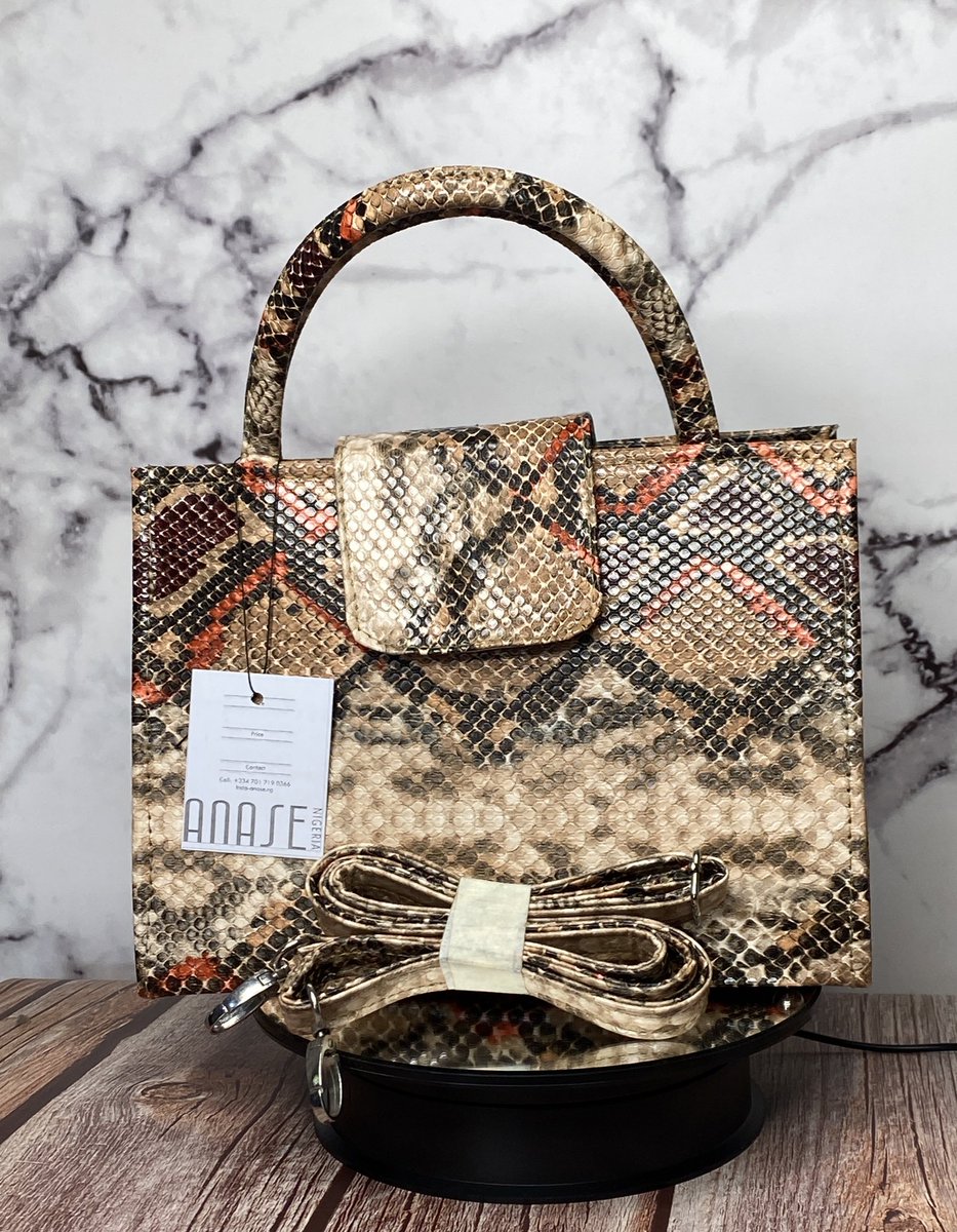 Anase_ng's tweet image. Heritage 001
The IFE bag.
NGN 18,000
Statement top-handle in a bold purple/blue python print with a detachable crossbody strap. 
Chic, compact and perfect for brunch, weddings, and everyday polish.
