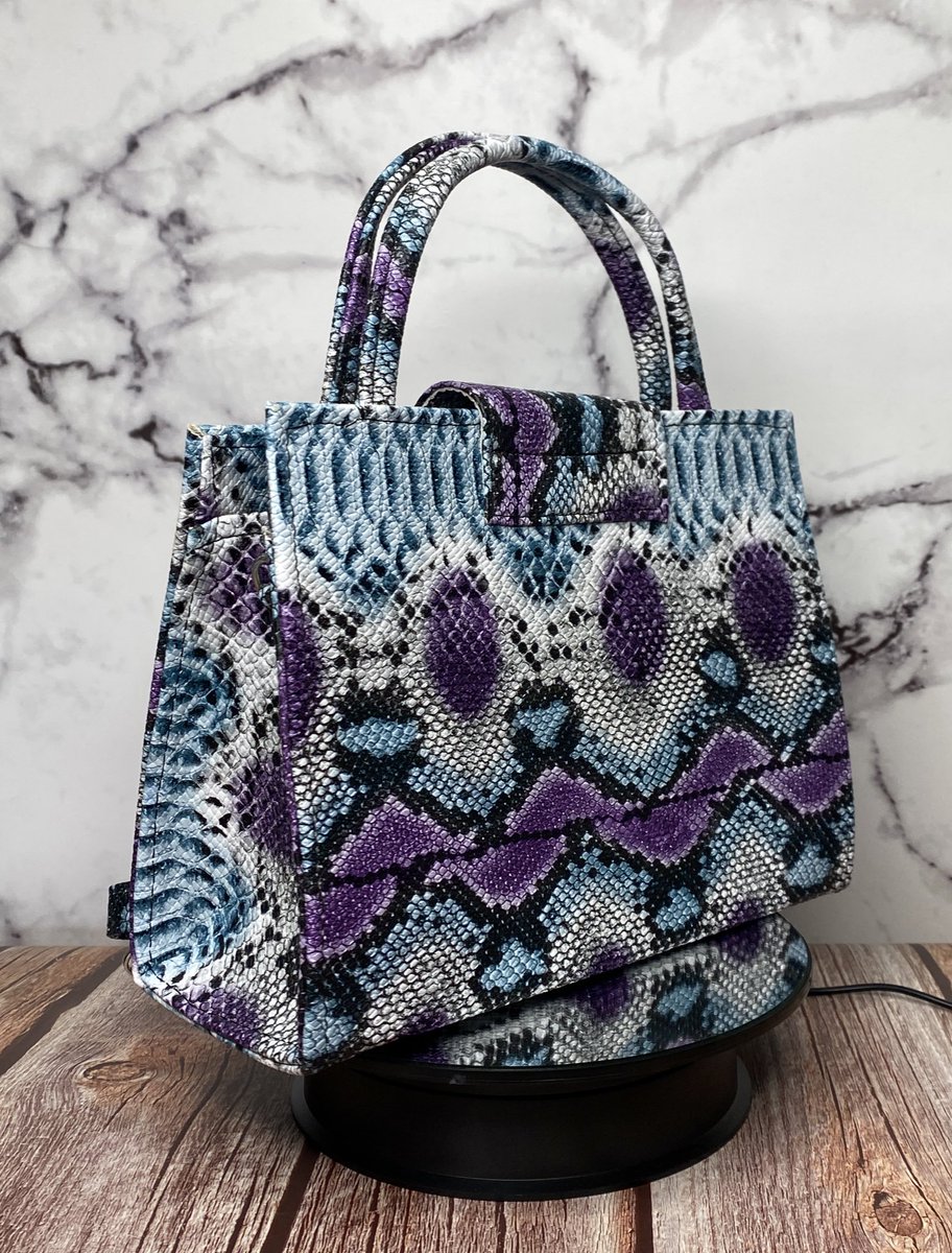 Anase_ng's tweet image. Heritage 001
The IFE bag.
NGN 18,000
Statement top-handle in a bold purple/blue python print with a detachable crossbody strap. 
Chic, compact and perfect for brunch, weddings, and everyday polish.