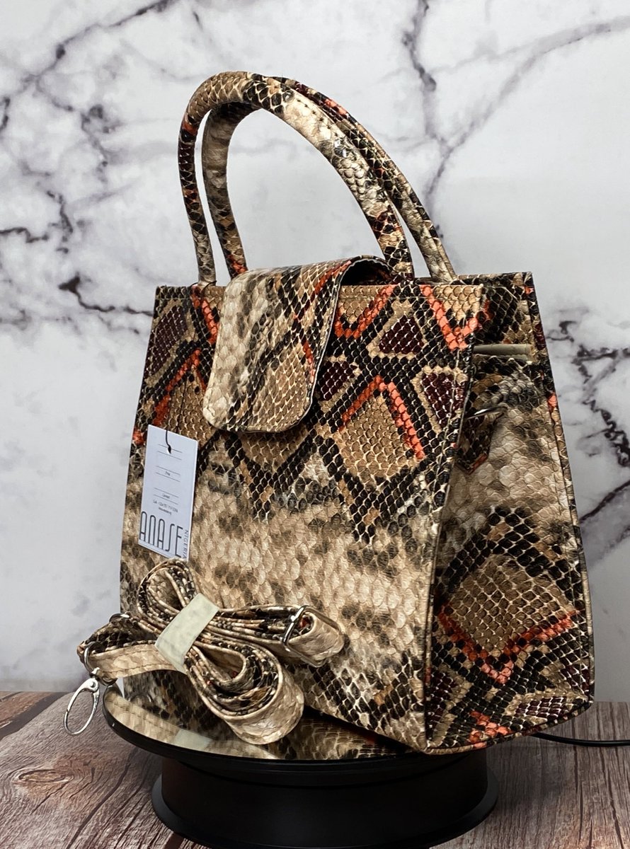 Anase_ng's tweet image. Heritage 001
The IFE bag.
NGN 18,000
Statement top-handle in a bold purple/blue python print with a detachable crossbody strap. 
Chic, compact and perfect for brunch, weddings, and everyday polish.