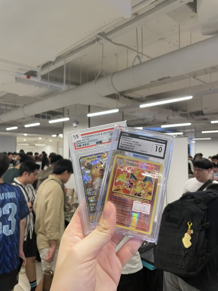 Just copped me a cool charizard and raichu, my first ever slabs 🥰