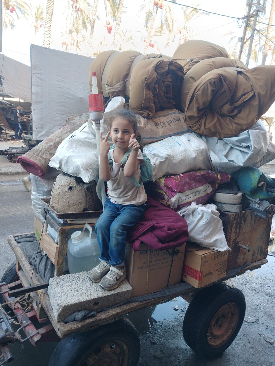 PalPress24's tweet photo. For the tenth time, my family and I are forced to flee again.
My little daughter Layan sits on a cart pulled by a frail donkey, carrying our tent, bedding, and the few belongings we have left, while I walk on foot holding what remains of our things. Ahead of us lies a long, exhausting journey—finding a piece of land to rent, preparing it for shelter, and building a new bathroom. It is truly a draining and overwhelming ordeal, both financially and emotionally.

And yet, despite it all, Layan sits smiling, enjoying the ride on the cart, as if her laughter tries to ease the weight of the road for me.
Displacement is painful and costly, but we are trying to hold on to life as much as we can.
To donate and support us in these difficult times…
https://t.co/hUJYiIiHUg