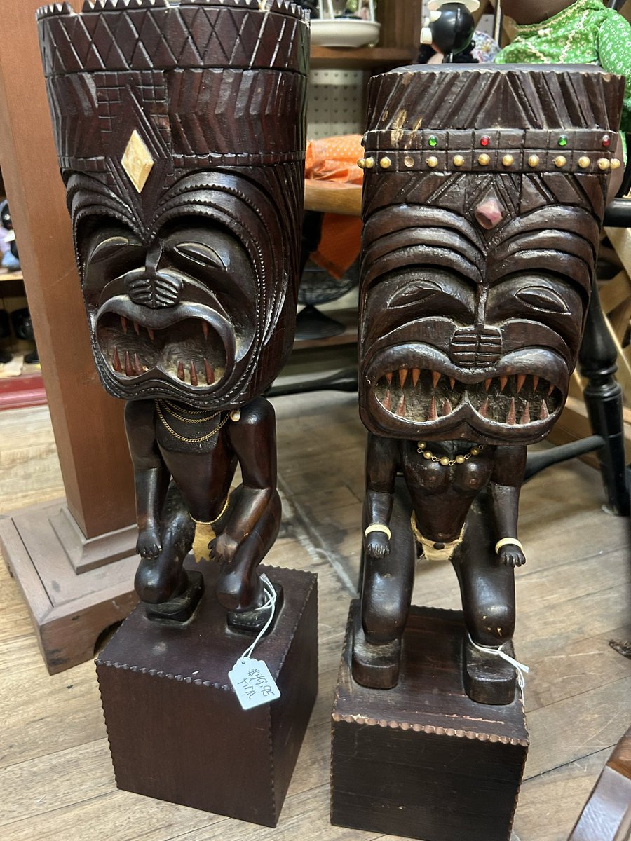 Nothing screams antique store like a couple of pooping cannibal statues