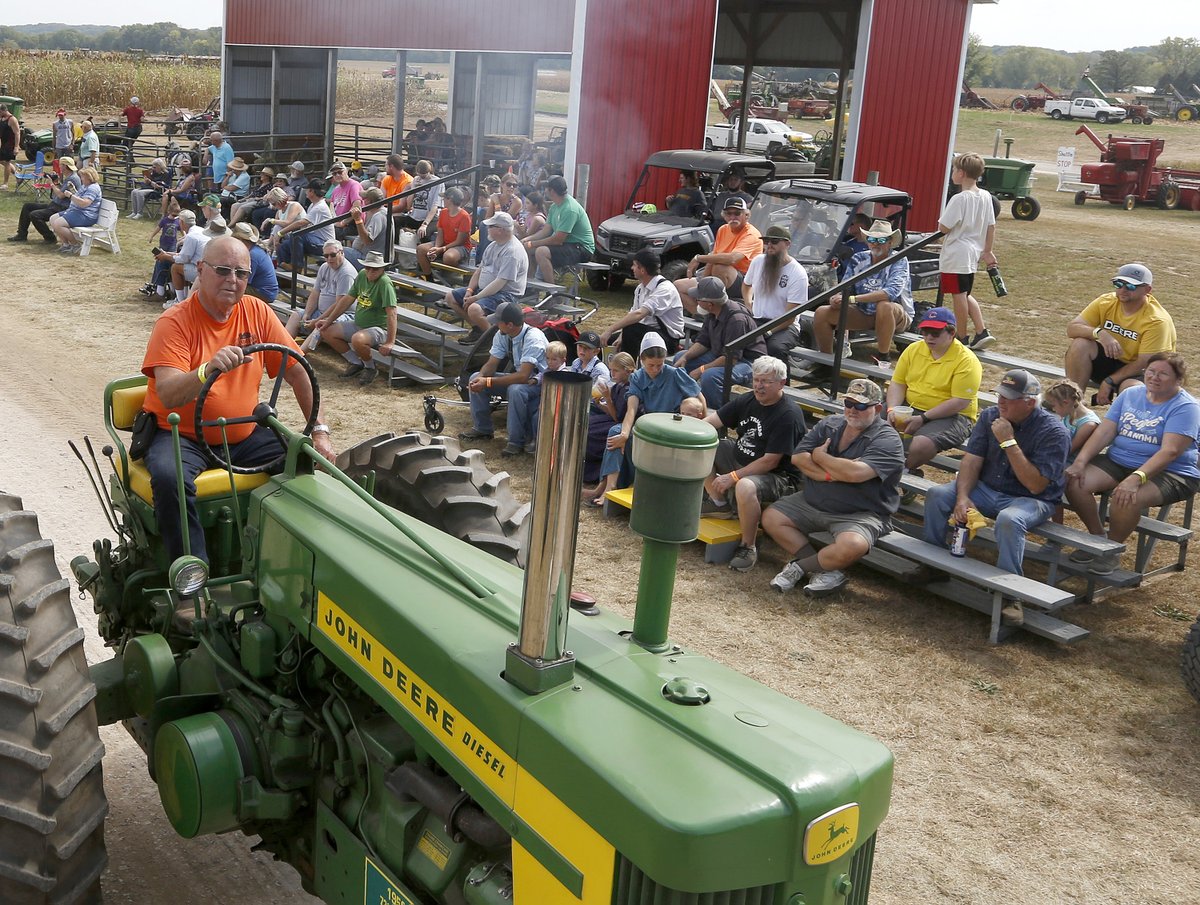 The 64th annual Working Farm Show near Geneseo, Illinois.   Equipment from the early to mid-1900’s are  harvesting  corn and soybeans.