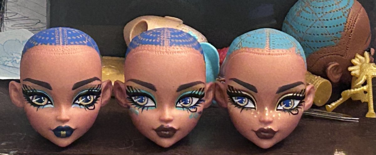 Three heads stand before me