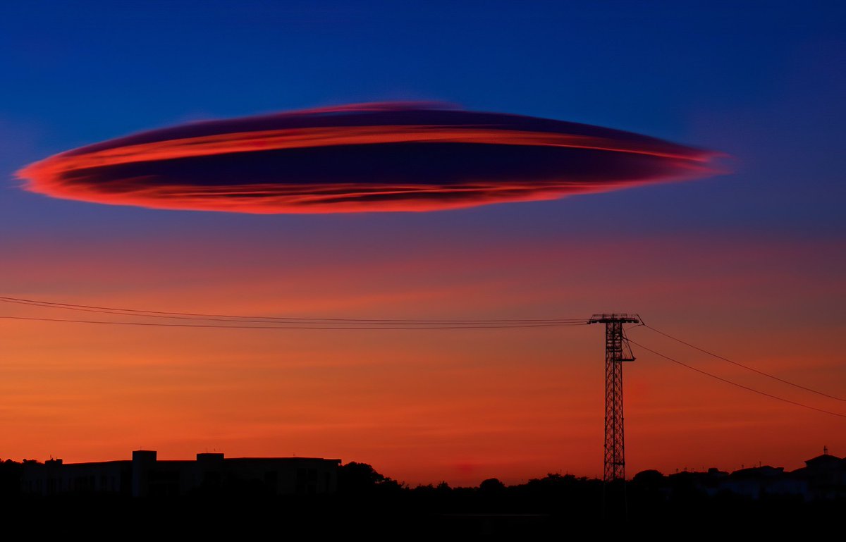 This Lenticular cloud   Taken while in Spain 1st picture is the original  and second has been enhanced