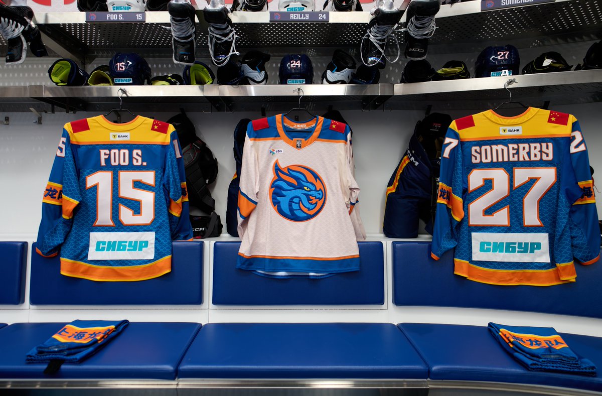Shanghai Dragons away jersey channels the Chinese dragon. Cream (not white) sets us apart in the KHL and evokes calm, timeless wisdom. The pattern blends dragon scales and ocean waves, nodding to St. Petersburg and Shanghai. Orange sleeve bands feature our name in white.