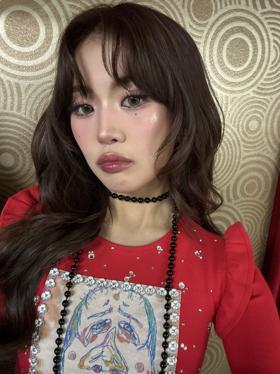 the artist wearing her artwork 🥹❤️‍🩹