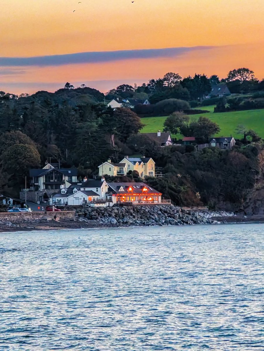aroundtenby's tweet photo. Ah, Wiseman’s Bridge at dusk, the lights twinkling like it’s just put the kettle on, saying, ‘come in, you’ll be cosy here.’ A perfect little postcard moment, beautifully caught by @lucycrockford. 🌅✨ https://t.co/QB3Z5o3K01