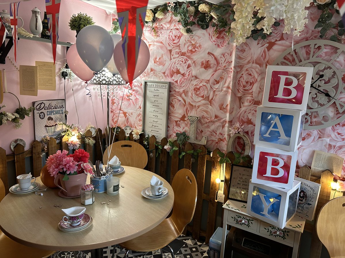 I’m at my third baby shower of the year, it’s at a very cute tea room not far from where we live