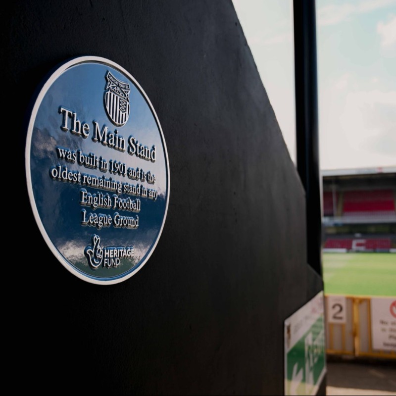 officialgtfc's tweet photo. Thanks to the work of @GTFCheritage, the Technical Absorbents Stand now has a blue plaque officially recognising it as the oldest remaining stand in any English Football League ground. 🏟️

#GTFC