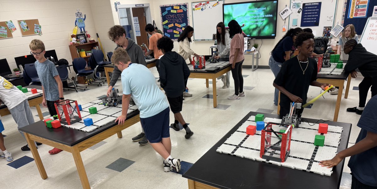 efmoore's tweet photo. In 8th Computer Science teams USED CODE to have ROBOTS move around the field, pick up cubes and hoop baskets! We also talked about rotation of wheels, measurement &amp; velocity 🤖🟥🟦🟩🗑️👍🏻 #FunFriday #WinWin https://t.co/WIYmxBVNil