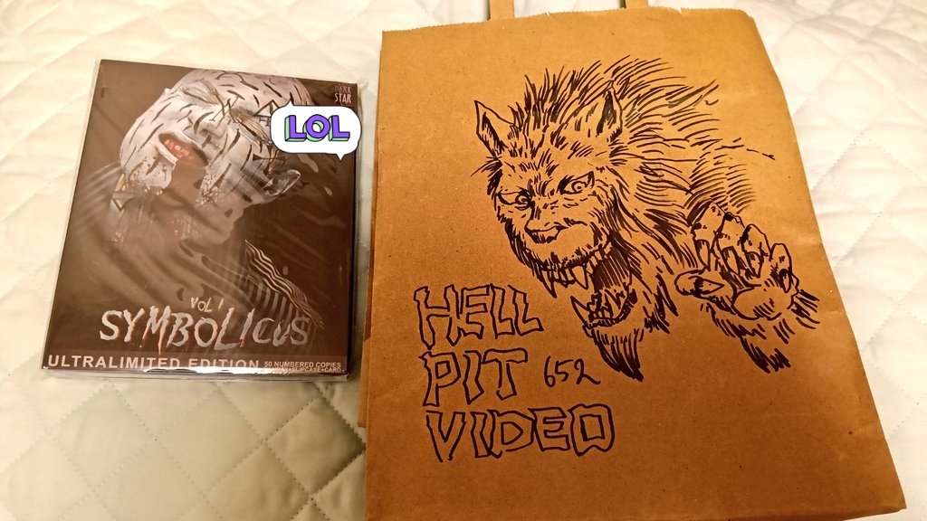 ヒロシニコフさん <a href="/toxicacidbath/">ヒロシニコフ</a> が始めたガレージショップ／Hellpit Video <a href="/HellpitV666/">HELLPIT VIDEO</a> へ、神戸散策がてら初訪問。店内の写真を撮り忘れたけど、とにかく映画ファン（特にホラー系）には目からウロコの品揃え。今回はオムニバスホラー集「Symbolicus Vol.1」50枚限定ブルーレイをGETしました。