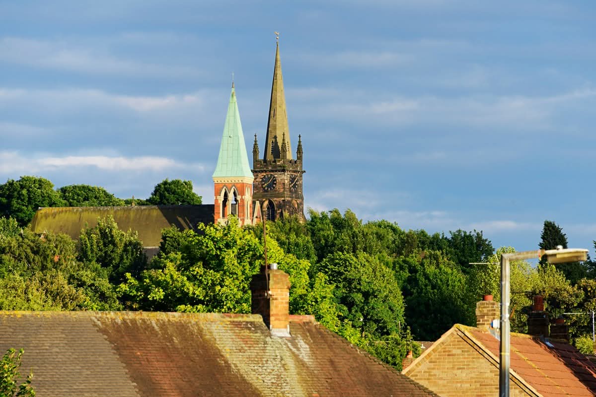 Lofty brothers in the Lord approaching a Black Country eventide. The Catholic church of Saint Mary on the Hill and it's hill top ecclesiastical neighbour, the Anglican church of St Bartholomew, #Wednesbury. Photographed on 21st June 2015, viewed from King's Hill.