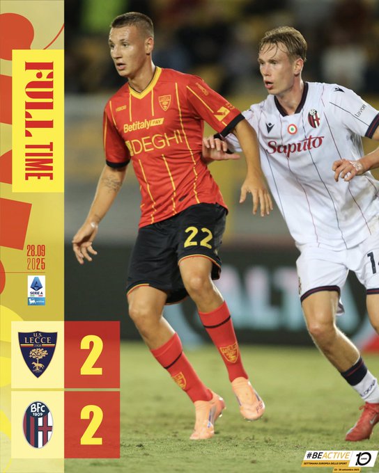 Two soccer players on a field. One wears a red and yellow striped jersey with "Betclic" and "DEGI" text, black shorts, and red socks with the number 22. The other wears a white and maroon striped jersey with "Sampdoria" text. A scoreboard shows 2-2. A watermark "BEACTIVE" is visible.