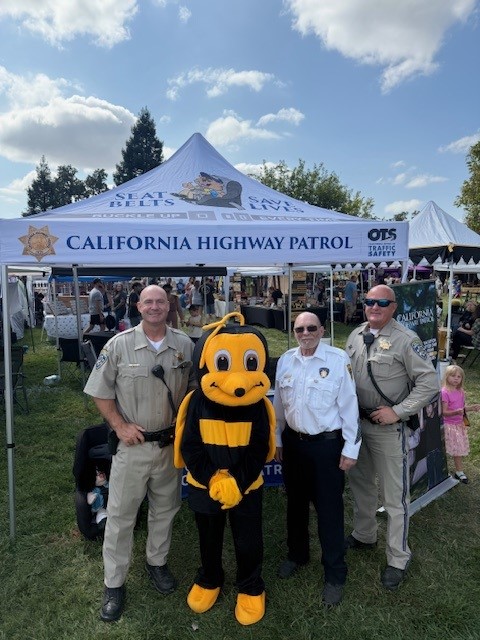 Officer Morton, Hisle and CHP Senior Volunteer, Morton at the Palo Cedro Honeybee Festival.