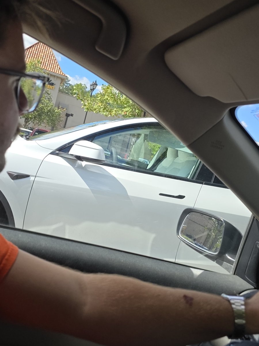 GraysonAri3l's tweet photo. Witnessed a Tesla pull out of a parking spot then drive past us in the lot... no one was in it... front or back.. is this legal or allowed??? Where is it going? https://t.co/zjajIs4u3Q