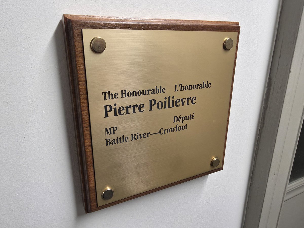 My old friend across the hall has returned... with a new plaque for his new riding.