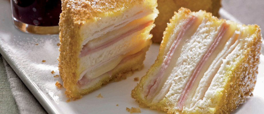 What's for #lunch? It's National Monte Cristo #Sandwich Day: ham, cheese, and turkey battered and fried, served with a side of jelly or jam for dipping. Delicious! Here's the recipe: t.ly/OQ_GY. #Recipes
