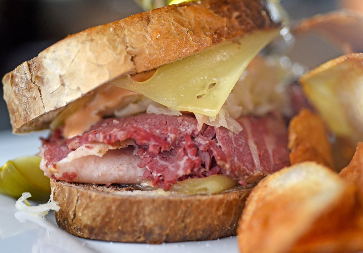 Fall in love with the taste of our crowd-favorite Five Spice Reuben! 🥪😍 Made with Grindstone's secret corned beef recipe, sauerkraut, Swiss cheese, and 1000 island dressing. #GrindstoneTapHouse #FoodieFave #MustTry