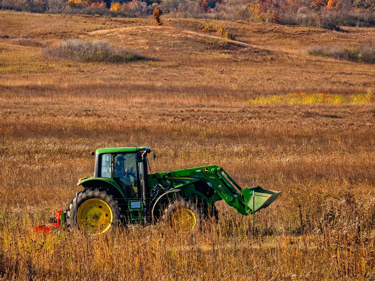 Putting a John Deere 6M to work for conservation! This tractor and flail mower are creating firebreaks for prescribed burns at Nachusa Grasslands, a key practice that helps the native prairie thrive. 🦬🦋🍂

📸: Charles Larry

#johndeere #tractor #prairie #nature #prescribedburn