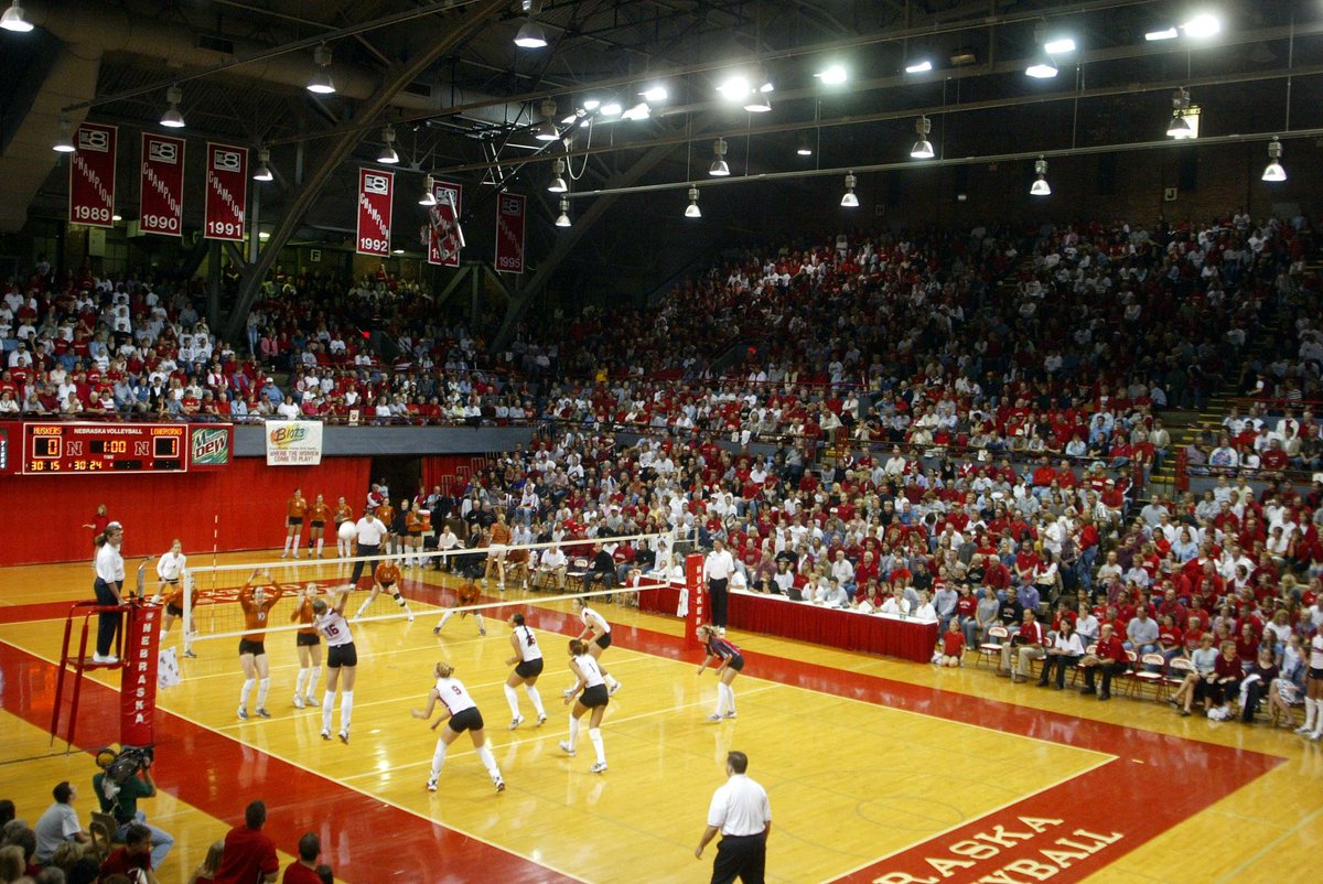 The best angle to televise a volleyball match is down the sideline and about 8' above the court. (Unfortunately, that is in the middle of the fans in DeVaney.) The birdseye view doesn't reflect the speed of the match. Scaffolding in the Coliseum put cameras in the perfect spot.