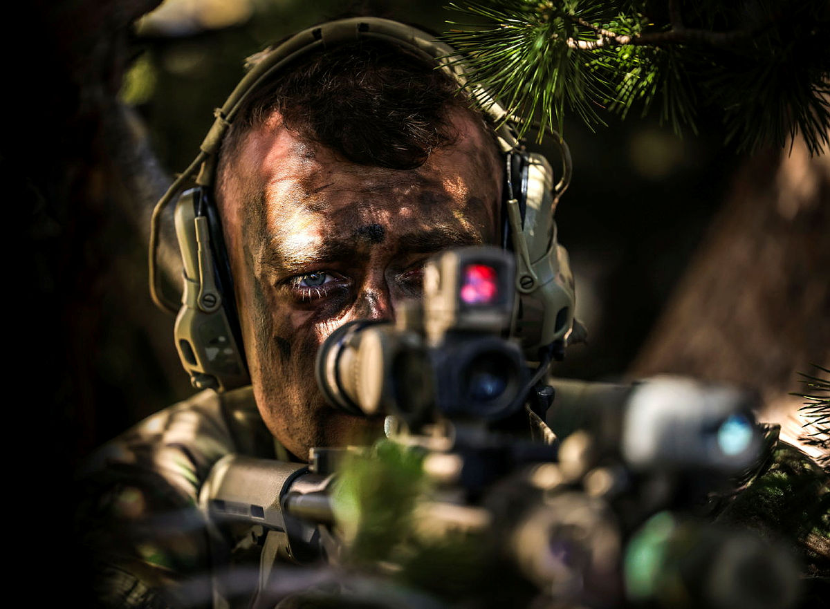 A UK Commando takes a firing position in an observation post during Ex Green Dagger.