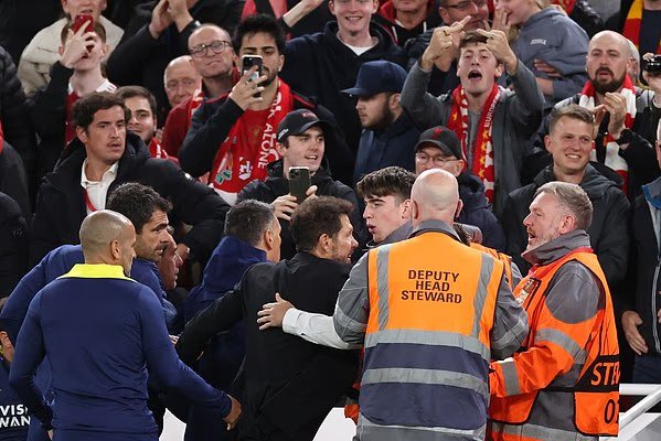 BPINewsOrg's tweet photo. Atletico Madrid boss Diego Simeone was shown a red card after a furious meltdown sparked by Liverpool’s late winner at Anfield. 

The Argentine appeared to gesture towards fans before being dismissed by referee Maurizio Mariani in stoppage time. 

#LFC #UCL https://t.co/TlyibDweZ0
