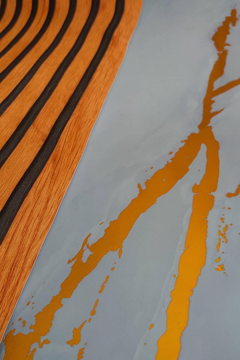 We have successfully designed an elegant and stylish aesthetic in our client's office, incorporating a blend of wood slat-style and marble-patterned wallpaper. The result is a stunning visual appeal.