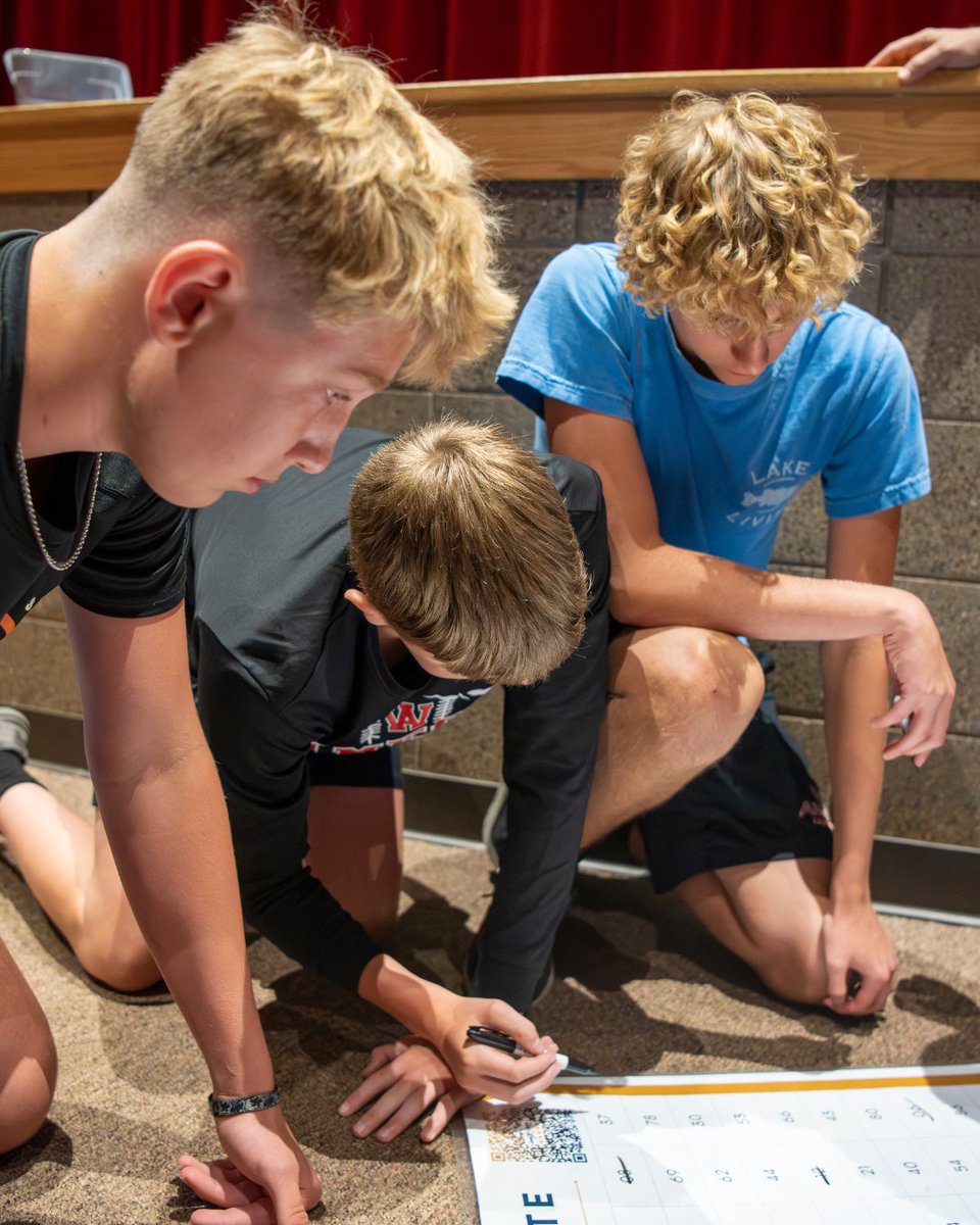 These boys are working together to boost their scores. The team concentration grid exercise teaches athletes the value of working together.